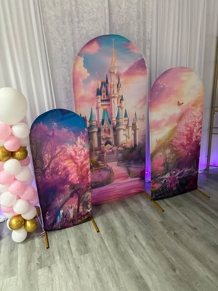 Princess baby shower backdrop with three castle arch panels and pink and gold balloons