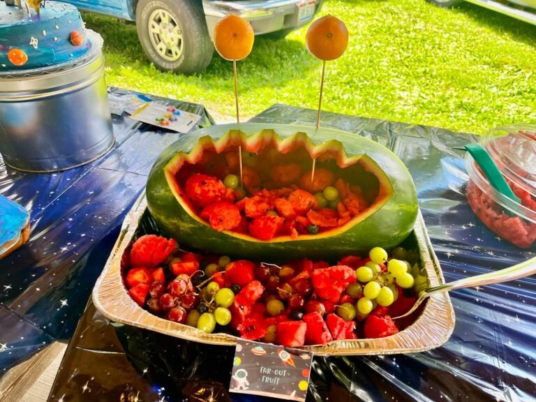 Watermelon bowl filled with strawberries and fruit