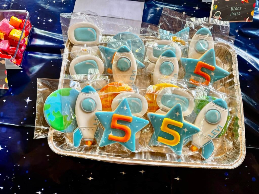Astronaut and number 5 cookies on a tray