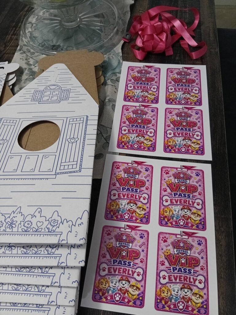 Cardboard pup houses with Paw Patrol sticker sheets