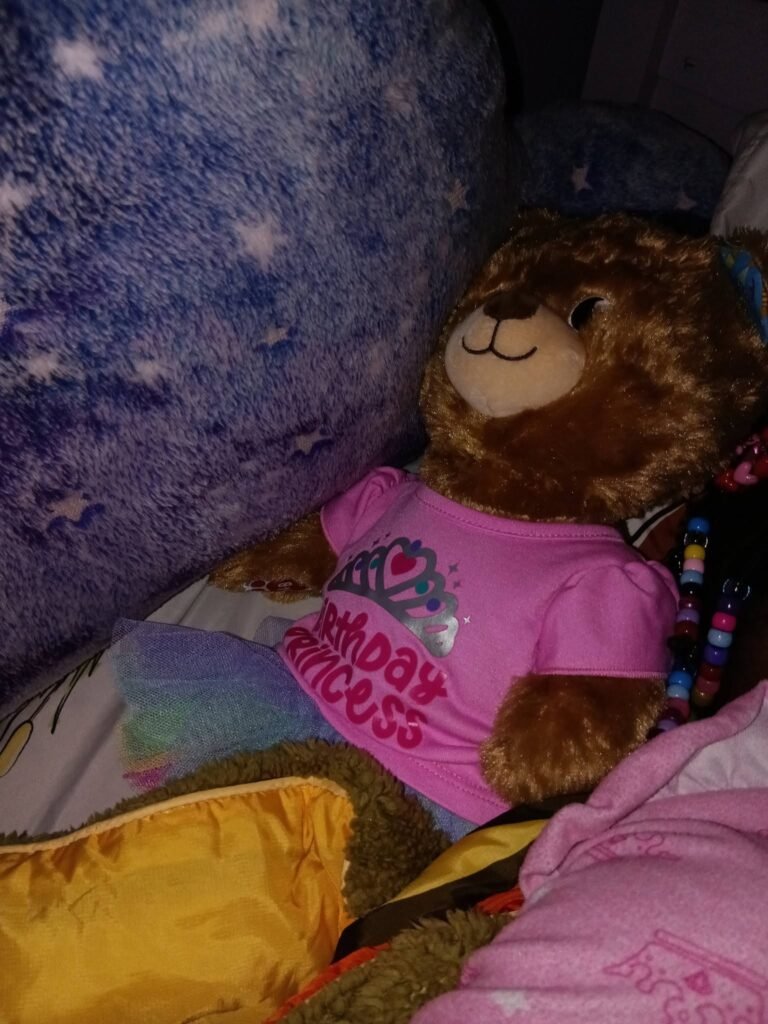 Plush pup tucked in a gift bag