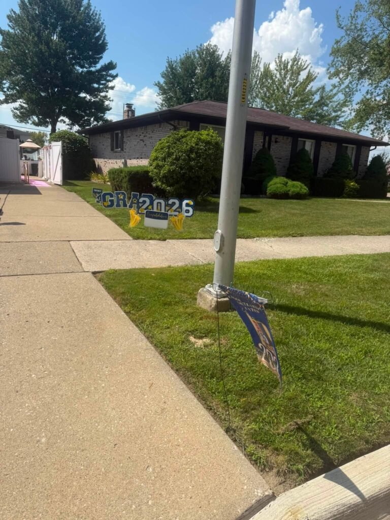 Class of 2026 yard sign on a front lawn
