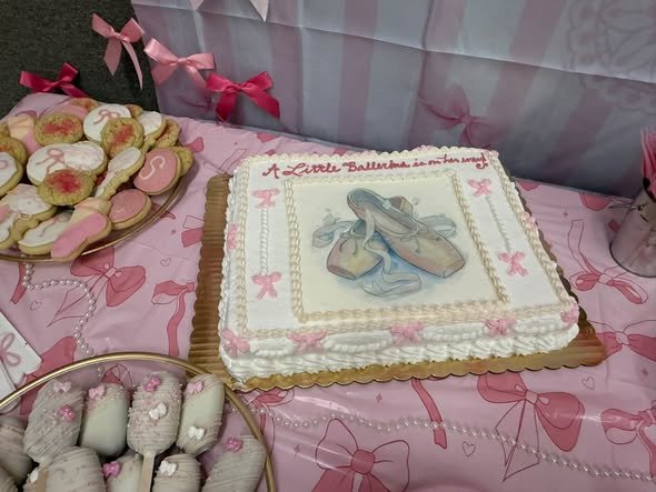 Baby shower sheet cake with ballet slippers and pink bows