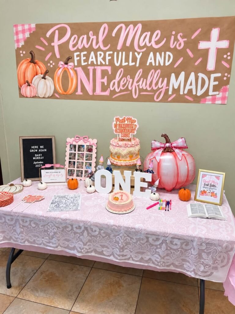 Pink pumpkin 1st birthday dessert table with a Fearfully and ONEderfully Made banner and ONE letters
