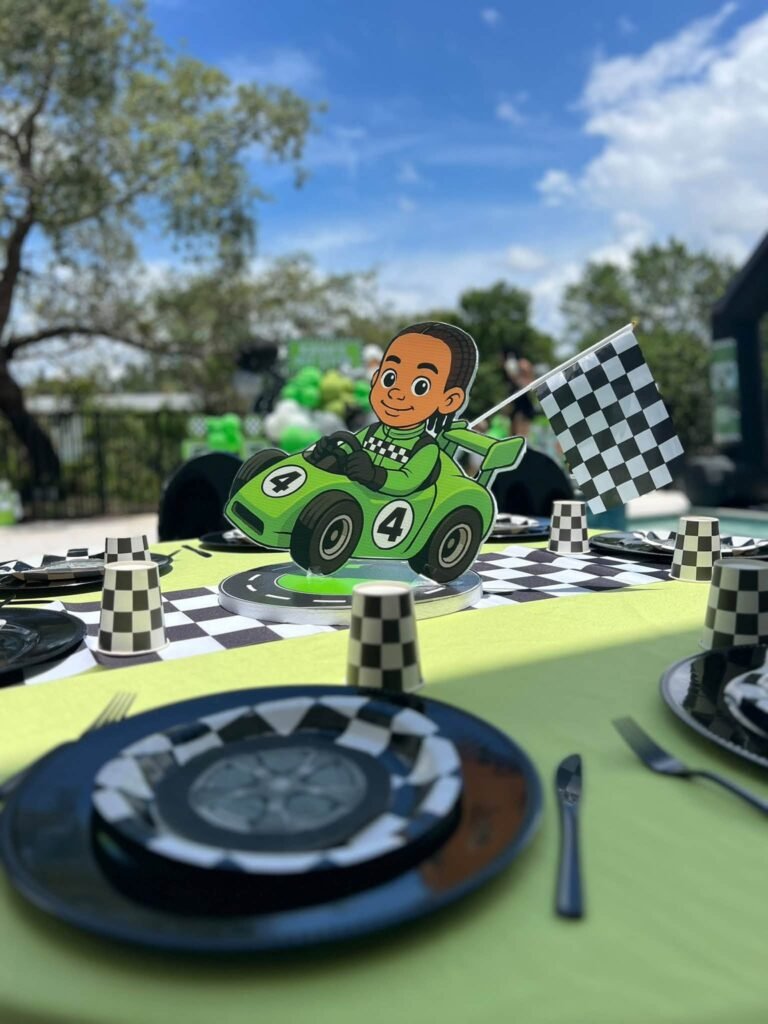 Checkered race car table setting with a black plate and a car centerpiece