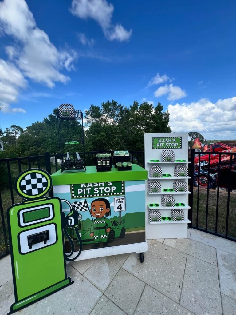 Pit stop favor stand with a green gas pump cutout