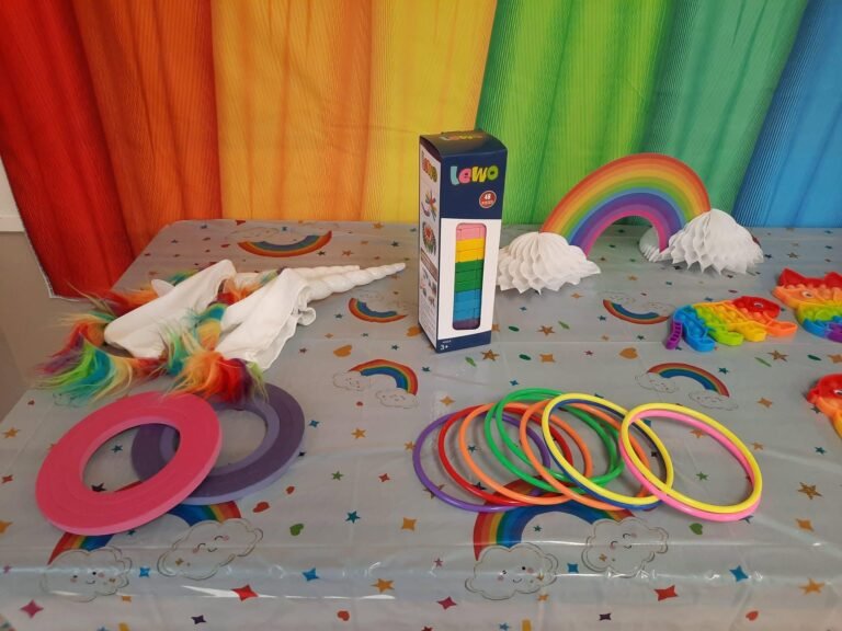Rainbow ring toss game on a party table