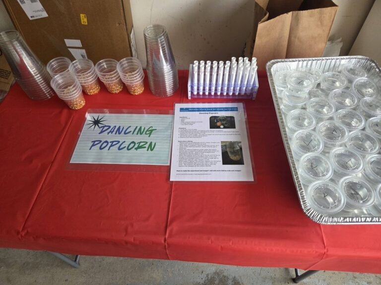 Dancing Popcorn station with cups and a sign
