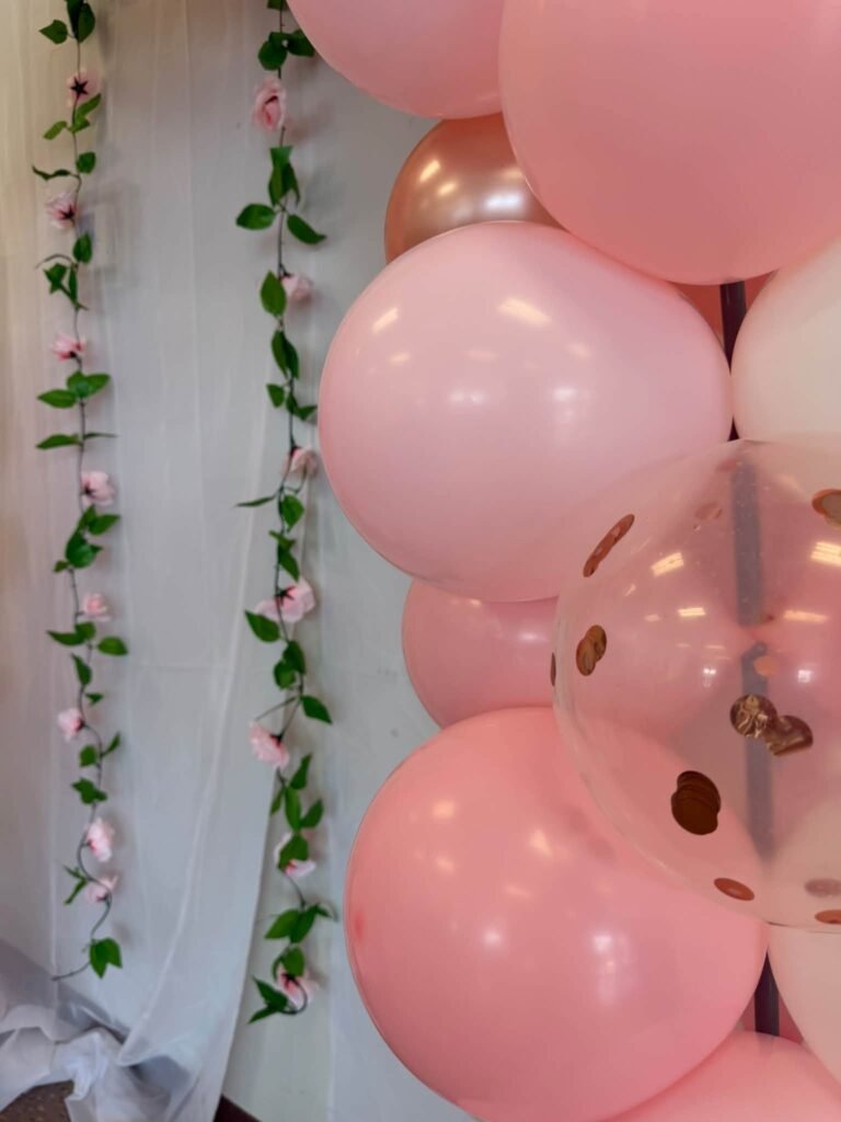 Pink balloons with flower vines