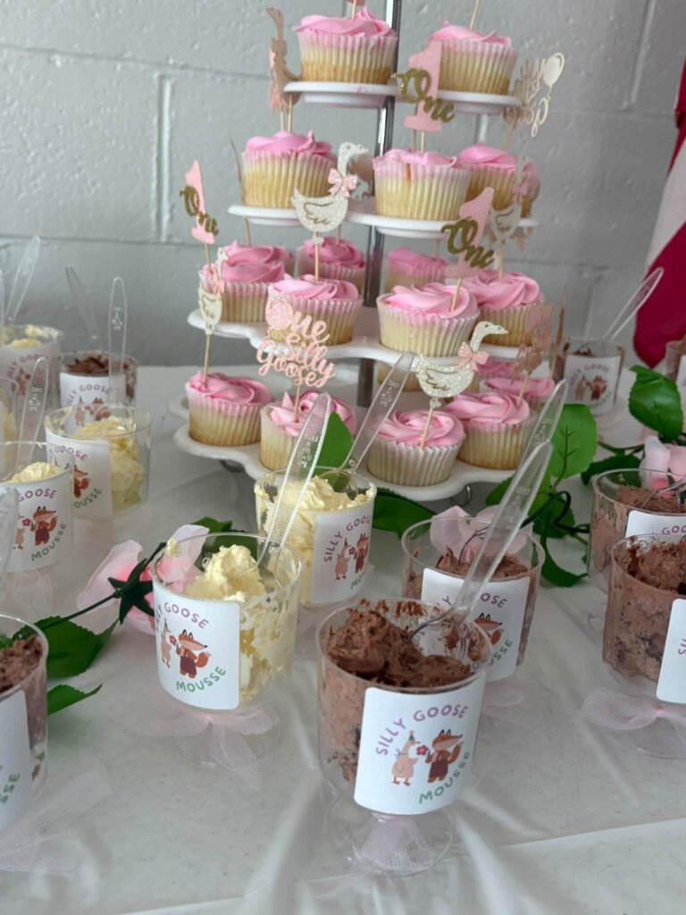 Dessert table with cupcakes and mousse cups