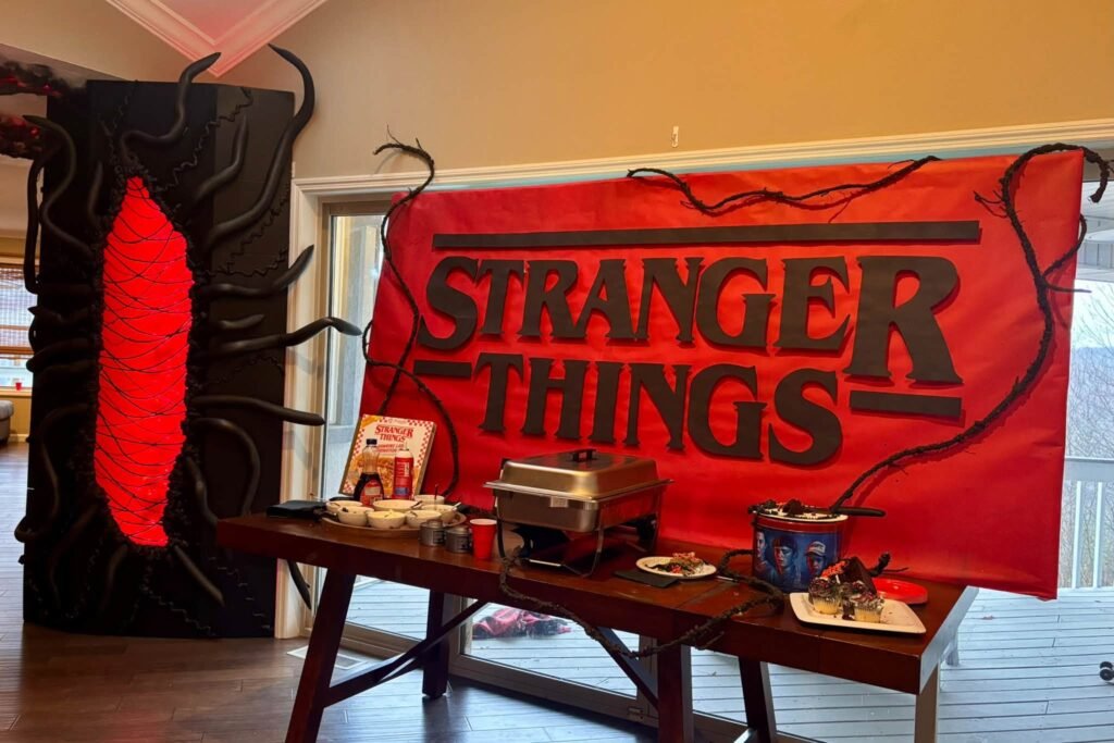Stranger Things banner over a red table