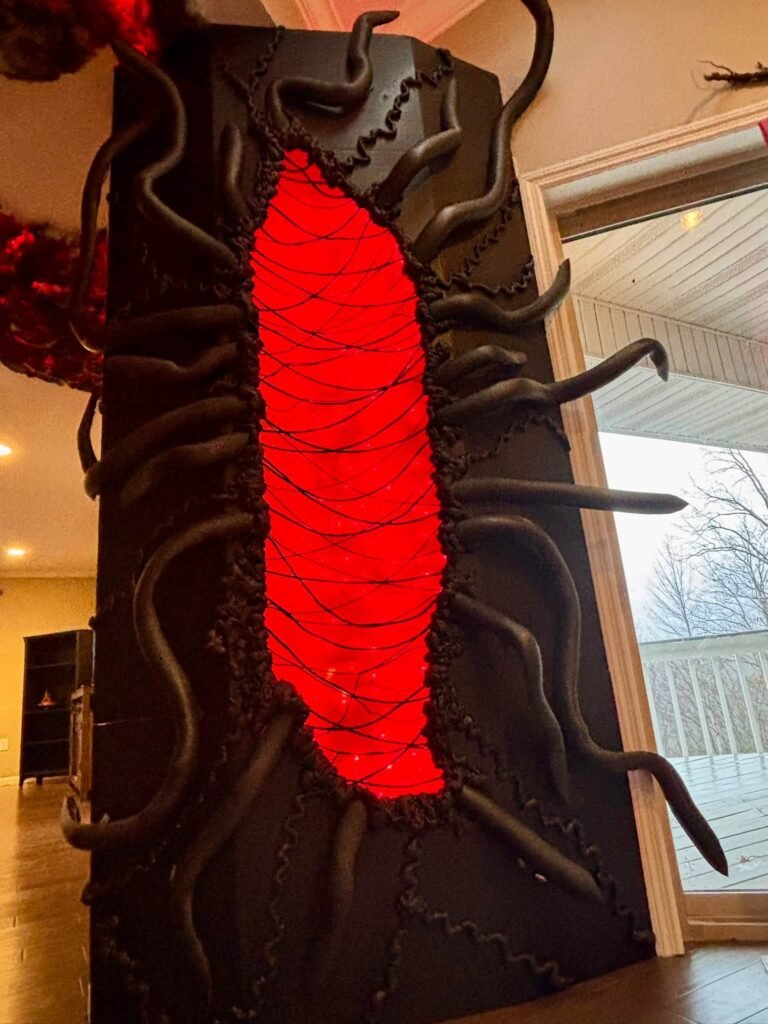 Black wall with a red glowing portal crack
