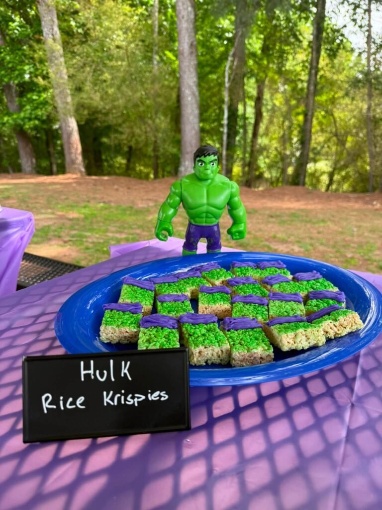 Green Hulk Rice Krispies treats on a blue tray
