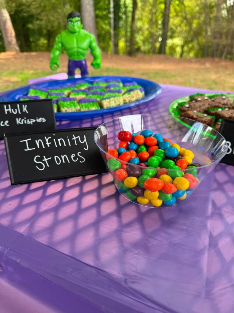 Infinity Stones candy in a bowl with a chalk sign