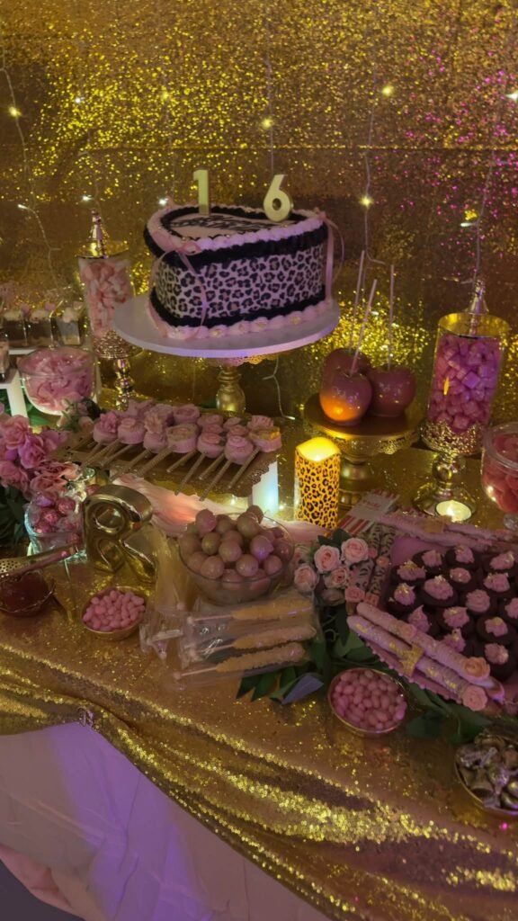 Cake with a 16 topper on the dessert table