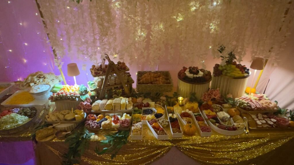 Food table under soft pink lights
