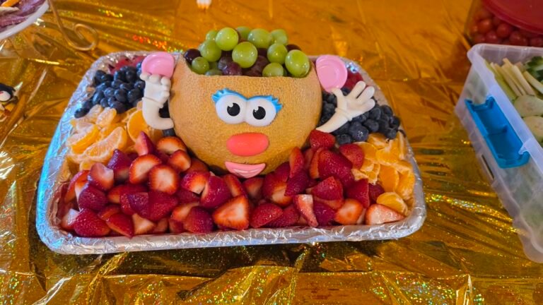 Mr. Potato Head fruit tray with strawberries, grapes and blueberries