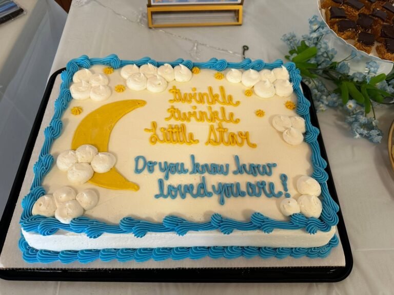 Twinkle Twinkle Little Star baby shower sheet cake with a gold moon and clouds