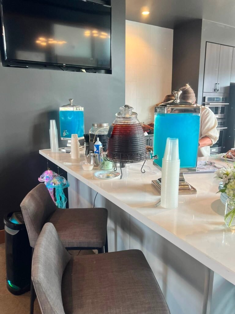 Blue drink dispensers on a white counter