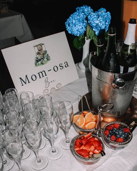 Mom-osa bar with champagne flutes, juice and fresh fruit