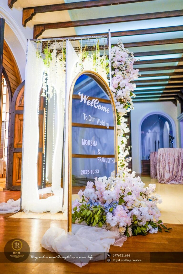 White and blue flower arch with a lit doorway backdrop