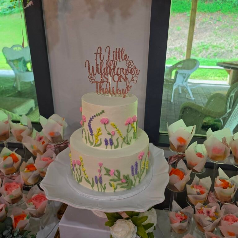 Two tier wildflower baby shower cake with a A Little Wildflower topper