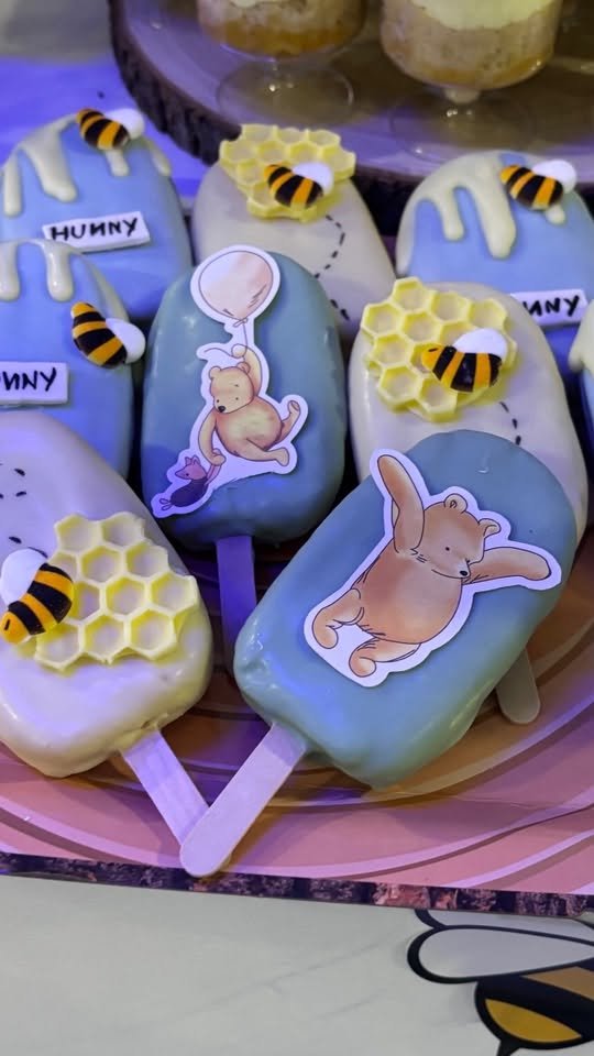 Cakesicles with Pooh, Piglet, Eeyore and bees